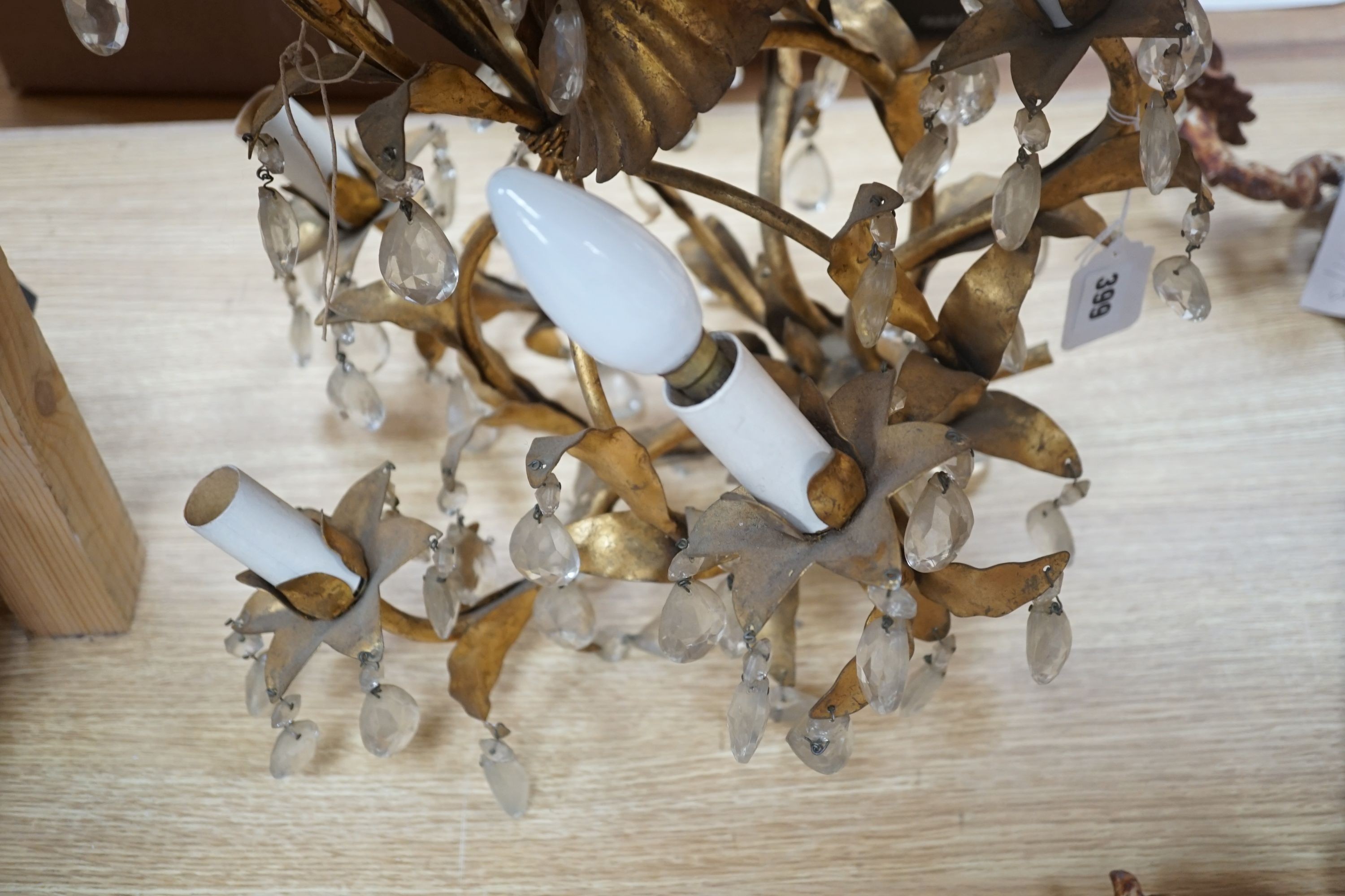 A gilt metal lustre drop chandelier